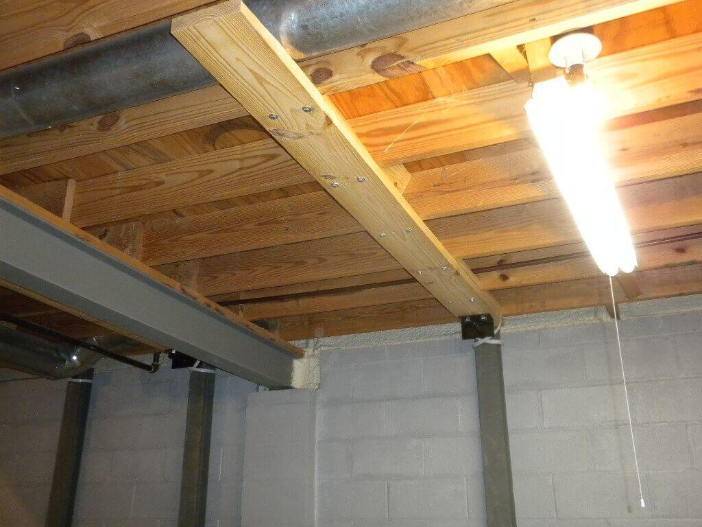 Steel Beams and Force Brackets on concrete brick wall | Steel I Beams Installed On Block Wall | Bowing Wall Repair Services | Area Waterproofing