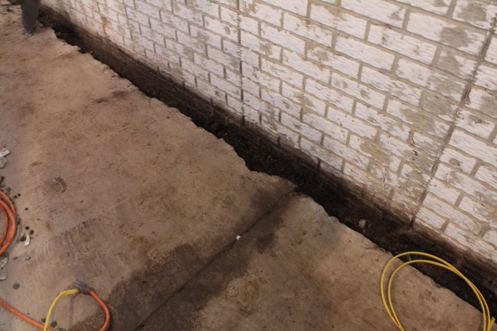 Broken up and cleared basement floor | Interior Waterproofing | Area Waterproofing